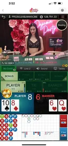Winbox AE Sexy Baccarat live dealer hosting an elegant game session with red rose background.
