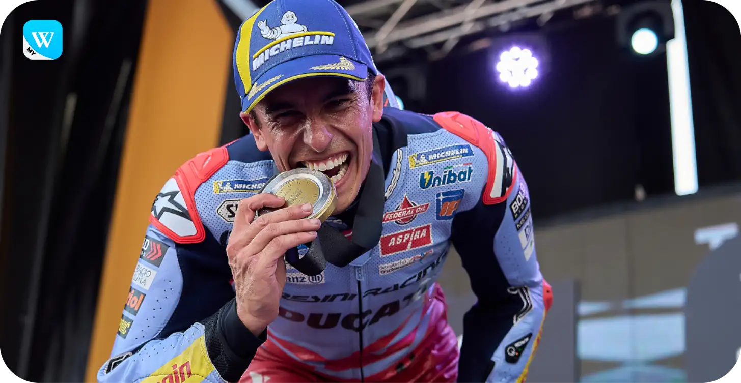 Winbox brand ambassador celebrating victory with medal
